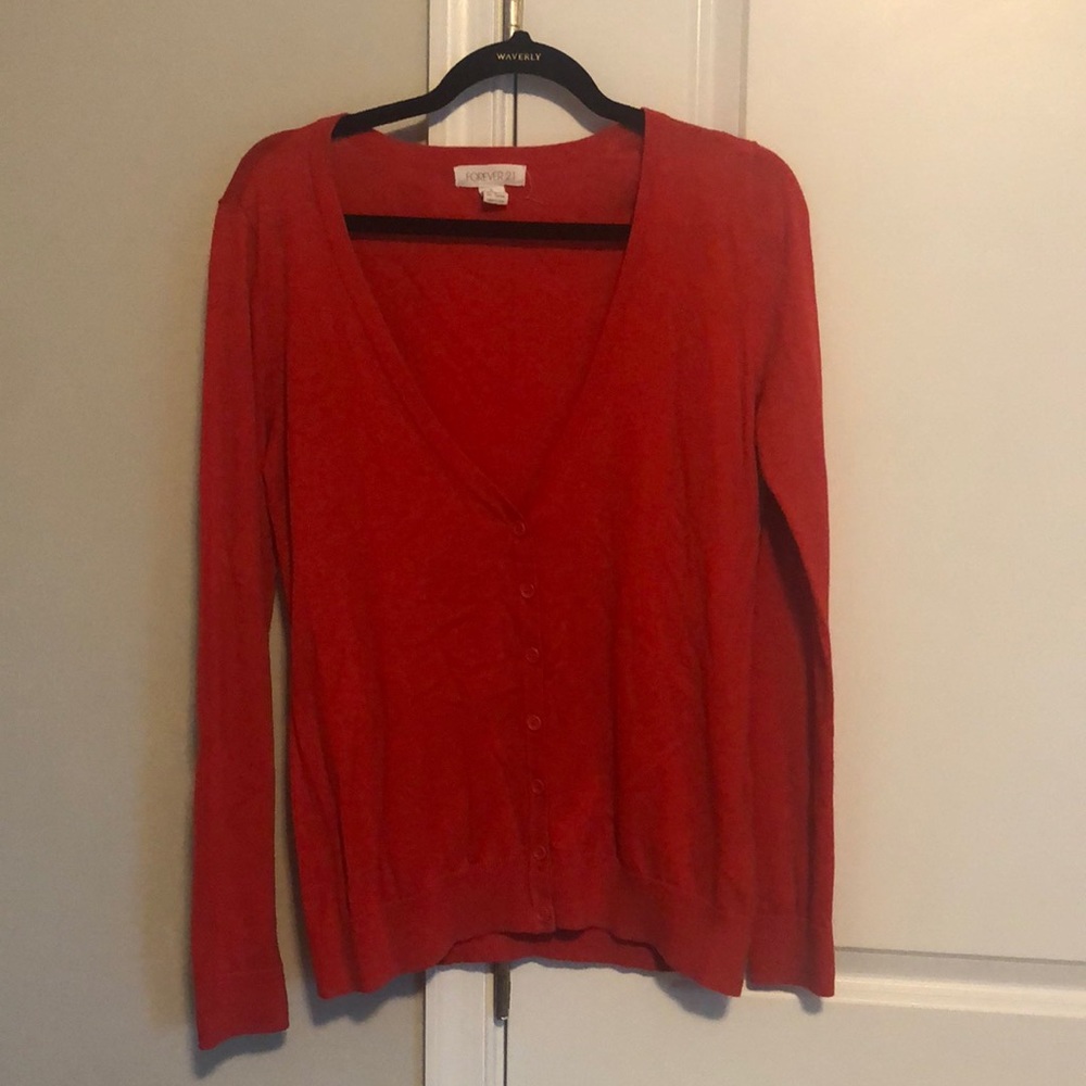 Red-orange 7 button cardigan. Gently worn. No tears. Medium.